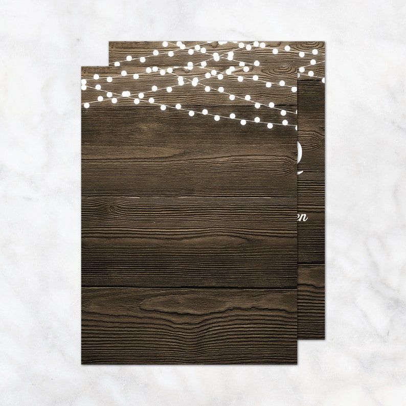 May include: A rustic wood background with white string lights. The lights are strung in a diagonal pattern across the top of the image.