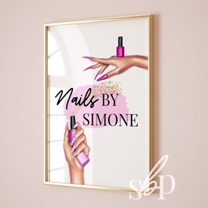 May include: A white poster with gold trim featuring a pink and gold design with the text "Nails By Simone". The poster features a hand with pink nail polish holding a bottle of pink nail polish.
