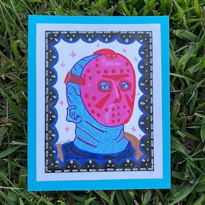 May include: A hand-drawn illustration of a character wearing a pink hockey mask with black straps. The character has blue skin and is surrounded by a black and white decorative frame.