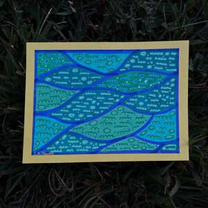 May include: Abstract painting on yellow paper with blue, green, and yellow colors. The painting features a pattern of wavy lines and circles.