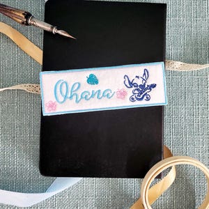 Marque-page brodé inspiré de Stitch de Disney, cadeau idéal pour les amateurs/trices de lecture et enfants.