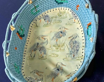 Heron gathering - handmade basket with pottery base.
