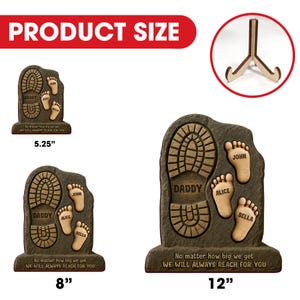 May include: A brown, stone-like plaque with a footprint design and the words "Daddy", "Alice", "John", and "Bella" engraved on it. The plaque is available in three sizes: 5.25 inches, 8 inches, and 12 inches. The plaque has the text "No matter how big we get, we will always reach for you".
