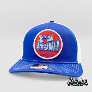 May include: A blue and white trucker hat with a red, white and blue embroidered patch that says "I'm Stoked!"