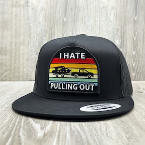 May include: Black trucker hat with a black and white patch that says "I hate pulling out" with a retro sunset design and a silhouette of a truck pulling a boat.