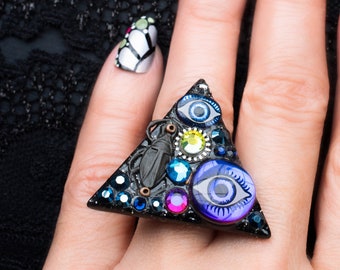 magic eyes triangle ring with small scarab beetle and sterling silver band
