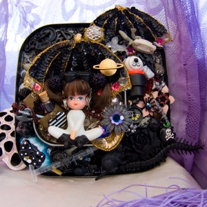 doll assemblage art. cat eye nebula by elfmadchen. one-of-a-kind original art.
