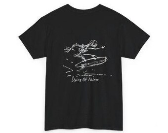 May include: Black t-shirt featuring a white graphic of a skeleton surfing. The phrase "Dying Of Thirst" is printed below the graphic. The shirt has a classic crew neck and short sleeves.