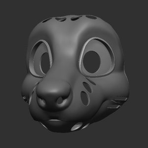 May include: A grey 3D model of an animal mask with large eyes, a prominent nose, and a detailed mouth. The mask has several small holes around the eyes and nose.