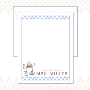 May include: White stationery set with a light blue border and a repeating pattern. The design includes a coffee cup illustration and the text "A Note From Mrs. Miller". Includes an envelope.