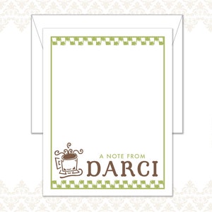 May include: White stationery set with a green border and accents. The design includes a coffee cup illustration and the text "A NOTE FROM DARCI". The set includes a matching envelope.