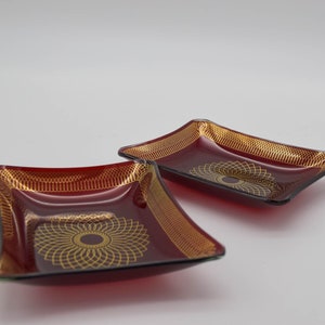 A pair of Vintage Mid century Swedish glass tray Dish by Svend Jensen of Denmark gold Spirograph Pattern on Ruby red glass
