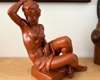 vintage nude clay sculpture of a seated woman