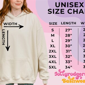 May include: A cream-colored unisex hoodie with a front pocket. The image includes a size chart with measurements in inches for sizes S through 5XL. The text "UNISEX SIZE CHART" is at the top, with the Jollyrodgers Bashwear logo at the bottom.