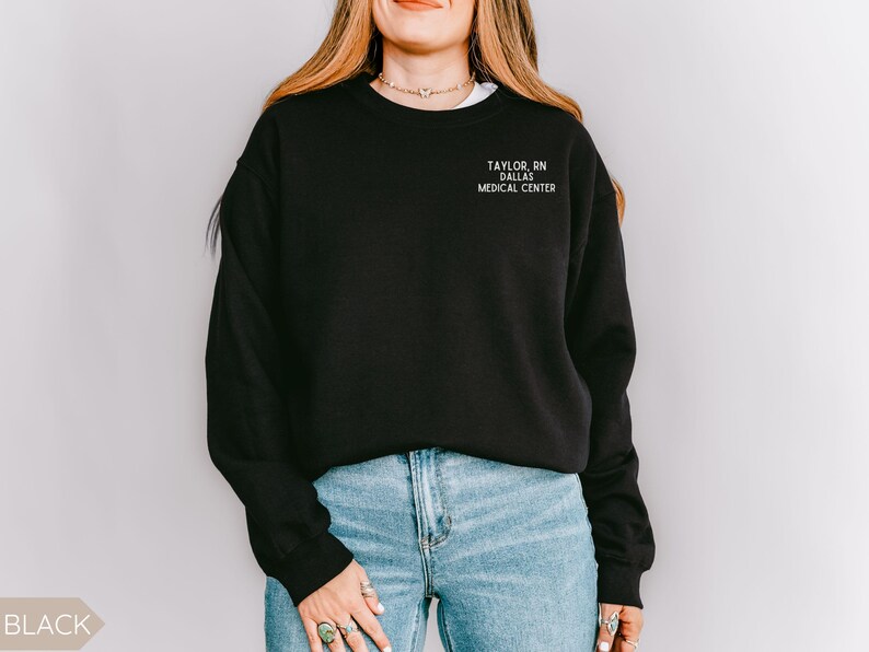 May include: Black sweatshirt with the text "TAYLOR, RN DALLAS MEDICAL CENTRE" in white.