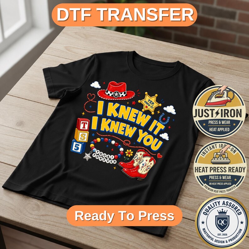 May include: A black t-shirt featuring a graphic print with the text I KNEW IT I KNEW YOU, a red cowboy hat, a yellow sheriff badge, red cowboy boots, alphabet blocks, and a beaded bracelet with the text YOU FOREVER, plus three circular labels.