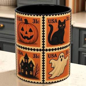 May include: A black cylindrical Halloween-themed container with a black interior. The exterior features four postage stamp designs with a pumpkin, black cat, haunted house, and ghost. Each stamp reads "USA" and "31c".