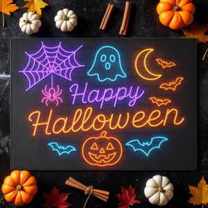 May include: A black Halloween-themed sign with neon-style illustrations of a spiderweb, ghost, moon, bats, and a jack-o'-lantern. The words "Happy Halloween" are written in neon. The sign is surrounded by pumpkins, gourds, cinnamon sticks, and fall leaves.