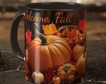 May include: Black coffee mug with a white "Welcome, Fall" inscription and a colorful autumn scene featuring pumpkins and fall leaves.