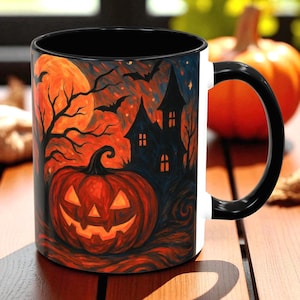 May include: A Halloween-themed coffee mug with a black interior and handle. The mug features a spooky design with a jack-o'-lantern, haunted house, bats, and a full moon in shades of orange, black, and blue. The mug is white on the exterior.