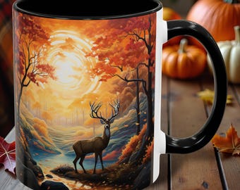 May include: A white ceramic mug with a black handle features a colorful illustration of a deer standing in a forest with a sunset in the background. The mug has a black rim.