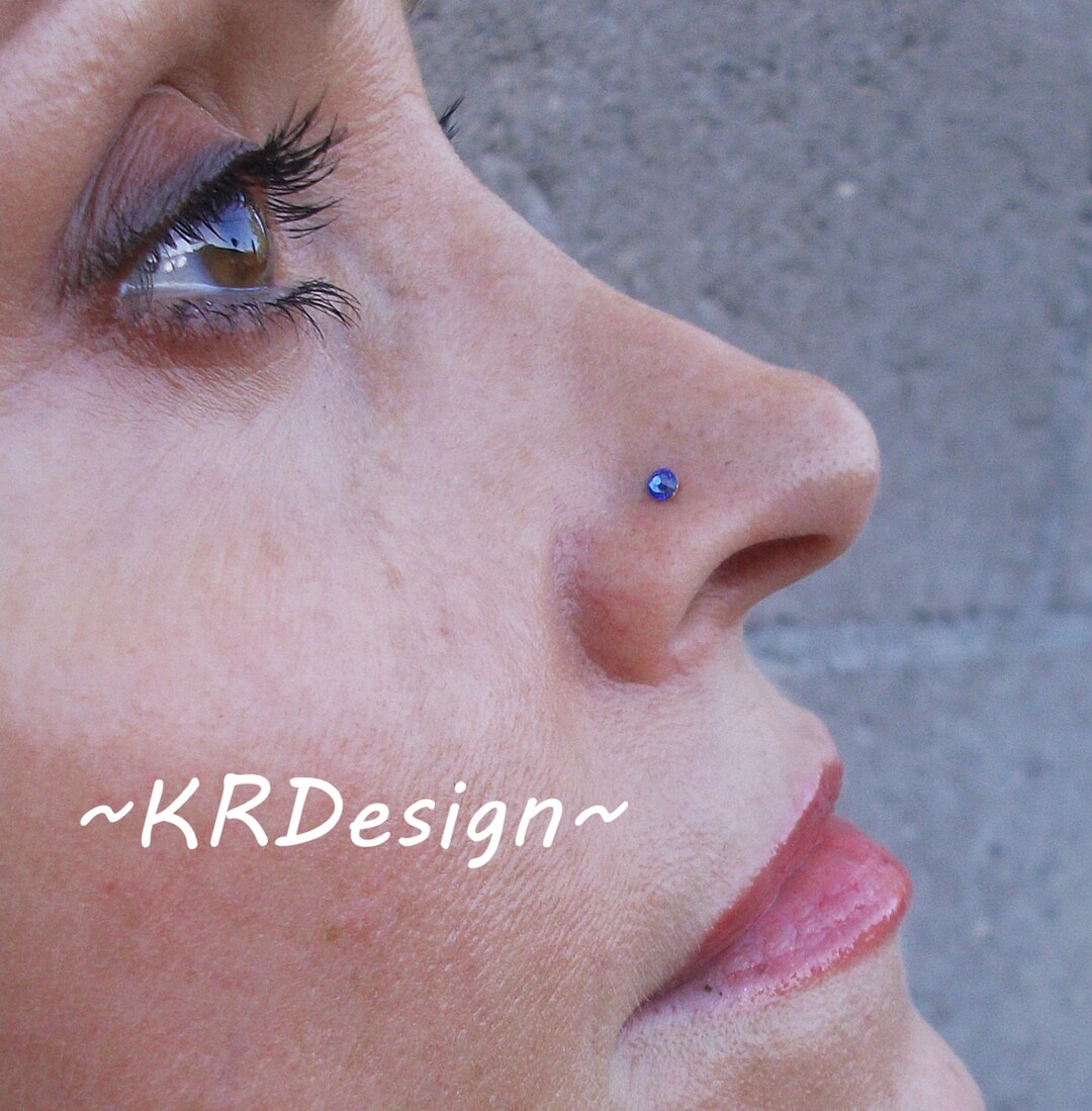 thumbnail image 2 of Wholesale Lot 8pc UV Acrylic Crystal Gem Nose Studs – 20g 6mm Bones & Nostril Rings 2 of 5