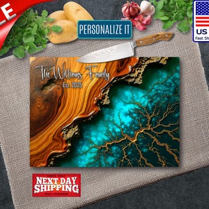 May include: A personalized cutting board with a unique design. The board features a blend of brown and teal colors, with gold accents. The text "The Williams Family Est. 2025" is displayed. A knife rests on top of the board.