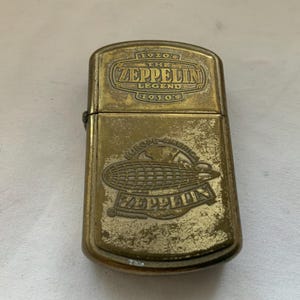 Old Vintage 1960’s Colibri V “The Zepplin Leged” 1920’s-1930’s Brass Flip Top Petrol Pocket Lighter