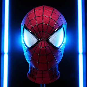 May include: A set of three ceramic mugs with a speckled, matte finish. The mugs are in shades of cream, light gray, and dark gray. Each mug has a simple, minimalist design and a rounded handle. The mugs are likely for coffee or tea.