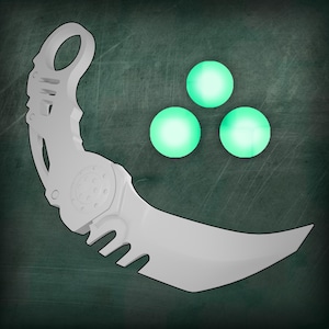 May include: A white, curved blade with a circular handle and a series of teeth along the bottom edge. Three glowing green orbs are positioned to the right of the blade. The blade has a mechanical design.
