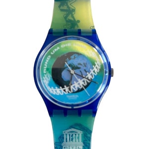 Orologio Swatch Gent vintage da 34 mm del 1996 - Rund Um Die Uhr GZ153 (UNESCO) - mai indossato, come nuovo e funzionante - nuova batteria installata