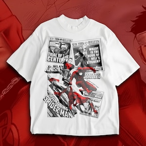 May include: White t-shirt with comic book graphics of Spider-Man and Daredevil. The design incorporates newspaper-style text elements, including "Trial of the Century" and "Where is the Devil of Hell's Kitchen?"