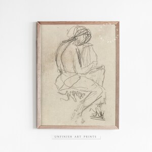 May include: A black and white pencil sketch of a person sitting with their legs crossed. The drawing is on a beige background and framed in a light wood frame.