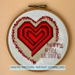 May include: A cross-stitch embroidery hoop with a red heart design. The heart is surrounded by a beige border and a wooden hoop. The text "HAPPY RUBY WEDDING" is stitched below the heart. The text "DIGITAL PATTERN - INSTANT DOWNLOAD" is at the bottom.