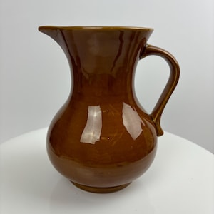 A Prinknash Pottery jug in a beautiful deep amber glaze.