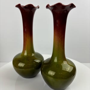 Palissy Pottery antique 7” vases with a fluted rim.