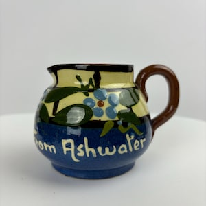 Devon Pottery Cream Jug with slip decoration and the words “From Ashwater”
