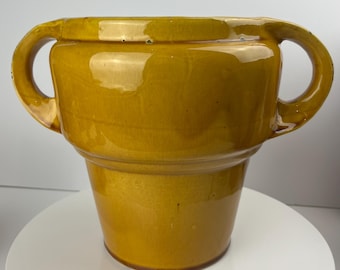 Antique (circa 1900) two handled 8”+ jardiniere in a deep yellow glaze. It is in fantastic condition.
