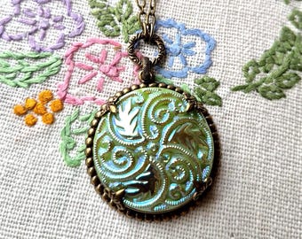 Necklace made using Czech Art Glass Button, Flower, Feather and Scroll Design, Iridescent Green, Brass