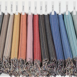 May include: A row of 15 fabric swatches in various colors, including light gray, dark gray, brown, light beige, mustard, orange, pink, red, black, navy blue, sax blue, parliament blue, turquoise, mint, and khaki green. The fabric has a checkered pattern.