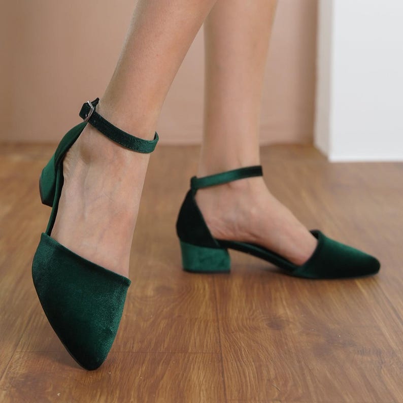 Woman wearing green block-heeled ankle strap shoes, showcasing the versatile and fashionable design.