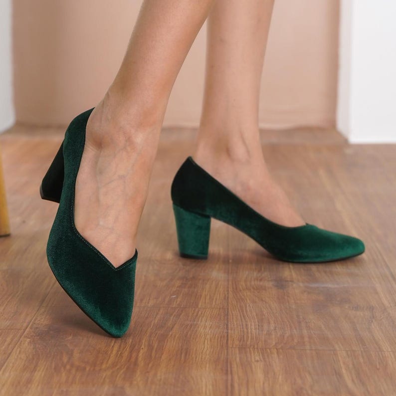 Close-up side view of green silky velvet bridal block heels, emphasizing the sleek design, medium high block heel, and comfort-focused fit by Hyl Wedding Shoes.