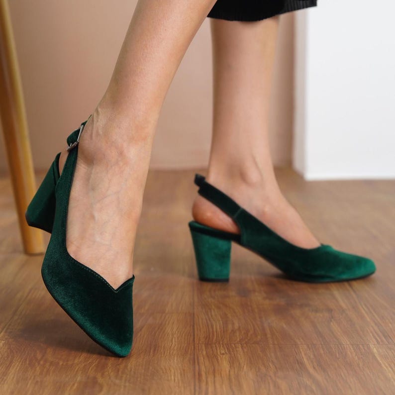 Side view of green silky velvet slingback medium high block Hyl Wedding heels showcasing the sleek design and adjustable strap.