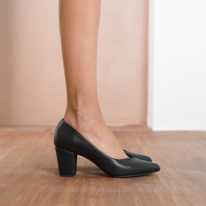 Angled side view of black vegan leather bridal block heels, highlighting the elegant design, medium high block heel, and supportive structure by Hyl Sweetheart Wedding Shoes.