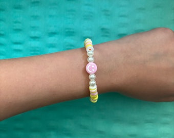 Pink lemonade smiley clay bead bracelet.