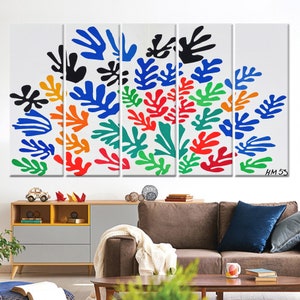 May include: A five-piece canvas print set featuring a colorful abstract design of stylized leaves in shades of blue, green, red, orange, and black. The print is set against a white background and includes the artist's signature "HM 53".