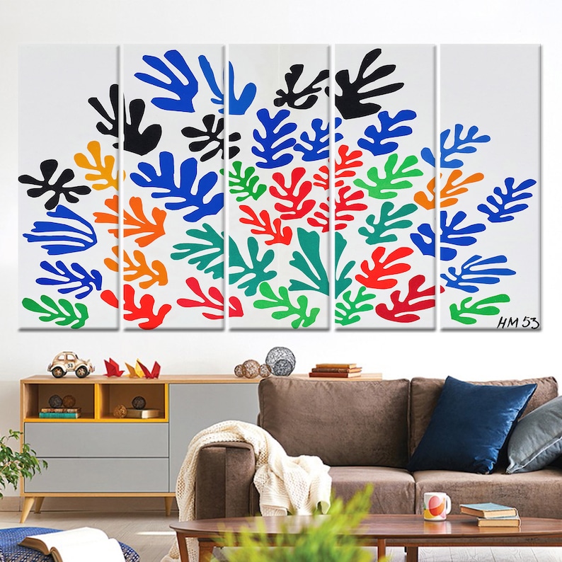 May include: A five-piece canvas print set featuring a colorful abstract design of stylized leaves in shades of blue, green, red, orange, and black. The print is set against a white background and includes the artist's signature "HM 53".