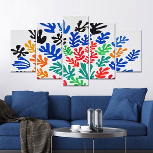 May include: A five-piece canvas print set featuring a colorful abstract design of stylized leaves in shades of blue, green, red, orange, and black on a white background.