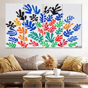 May include: A multi-panel canvas print featuring a colorful abstract design of stylized leaves in shades of blue, green, red, orange, and black. The print is signed "HM 53" in the bottom right corner.