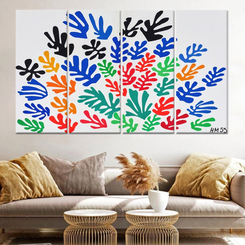 May include: A multi-panel canvas print featuring a colorful abstract design of stylized leaves in shades of blue, green, red, orange, and black. The print is signed "HM 53" in the bottom right corner.